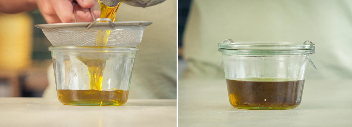 Olio d’oliva infuso con cannabis filtrato attraverso un colino a maglia fine in un contenitore di vetro.